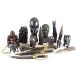 A quantity of tribal art, to include African busts, carved wooden figure, carving sets, nutcrackers,