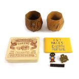Two Robert Thompson of Kilburn design Mouseman napkin rings, 6cm high (2), and a tin containing thre