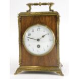 A French mahogany and brass carriage timepiece, with hinged handle, with white enamel dial with Arab