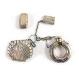 A silver plated chatelaine, envelope stamp box, dragon top ring shaped miniature decanter and coin p