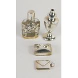 An envelope shaped stamp box, marked 925, 3cm wide, various small silver, cut glass perfume bottle w