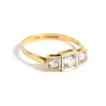 A 9ct gold Art Deco style ring, set with three white stone, size L/M, 1.5g all in.
