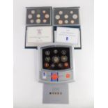 Various Royal Mint coin sets, a Deluxe Proof Edition 2000 set, and proof sets for 1983, and 1990. (3