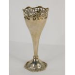 A George V silver vase, by Mappin & Webb, with pierced fleur de leys style decoration, on tapering s