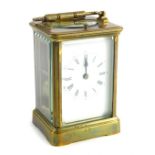 An early 20thC brass repeating carriage clock, in rectangular case with back plate, Roman numeric di