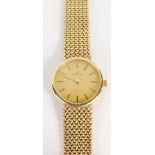 A 9ct gold Garrard quartz wristwatch, with 2cm diameter dial with baton numerals and pointers, and a