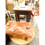 An oak workshop stool, with pierced handle to the seat, a circular coffee table, and a camel stool.