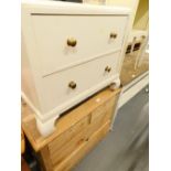 A small stripped pine chest, of two short and two long drawers, various brass handles within, on bra