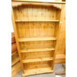 A pine open bookcase, with fixed shelves on bracket feet, 165cm high, 89cm wide.