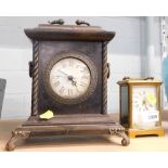 A brass carriage clock and a further mantel clock.