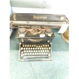 An Imperial typewriter in black, with gilt highlights.