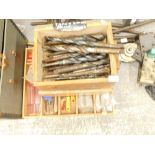 A quantity of tools, to include large engineering drill bits, clamps, workshop tank, machete, etc.