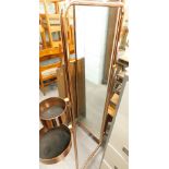 A modern copper effect cheval mirror, with trinket compartments, etc.