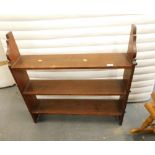 A teak open bookcase with three shelves. 85cm wide