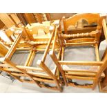 A set of six oak ladder back chairs, each with a padded seat. The upholstery in this lot does not co