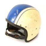 A motorcycle racing helmet, in cream with blue stripe.