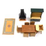 A small group of wooden doll's house furniture, comprising log burner, dresser, rug, high chair, din
