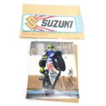 Motorbike racing interest, comprising a Valentino Rossi coloured photograph bearing biro signature,