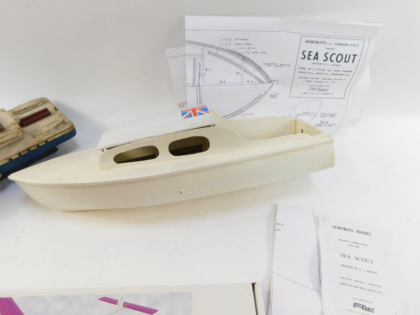 Two painted wooden boats, comprising blue, cream and red painted tug boat, 54cm long, and a white pa - Image 3 of 4