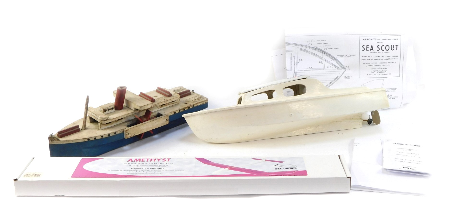 Two painted wooden boats, comprising blue, cream and red painted tug boat, 54cm long, and a white pa