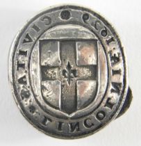 A 17thC Lincoln lead seal, of oval form, centred with shield and marked CIAITAS TIMCOTMIVE, dated 16