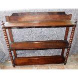 A Victorian mahogany wall shelf, with turned finials and bobbin turned supports, 71cm high, 80cm wid