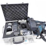 A Minolta 404SI Dynax camera, a Hoya 55mm skylight lens, other Minolta camera related equipment, con