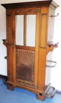 A late 19th/early 20thC Arts and Crafts hall cupboard by Thomas Edwards, Newcastle, the top with a