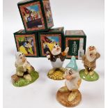 Four Royal Doulton porcelain figures from the Snow White and the Seven Dwarfs series, comprising Sne