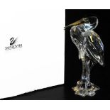 A Swarovski crystal figure of a heron on branch, A7679, 15cm high, in fitted box with outer packagin