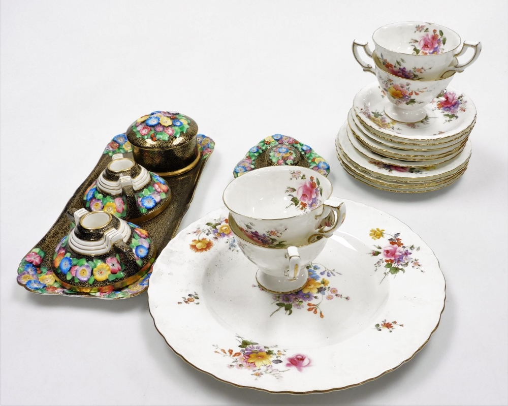 A Royal Crown Derby part tea service, decorated in the Vine pattern, comprising four teacups, six sa