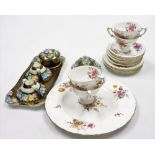 A Royal Crown Derby part tea service, decorated in the Vine pattern, comprising four teacups, six sa