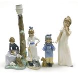 Four Nao porcelain figures, comprising girl in white nightgown yawning, 28cm high, girl in duffel co