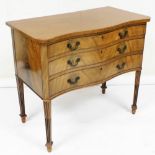 An Edwardian mahogany serpentine fronted canteen chest, with three long drawers, two fitted, on flut