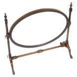 An Edwardian mahogany swing frame toilet mirror, the oval plate on turned supports with cabriole leg