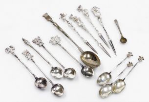 A group of small silver and white metal flatware, to include four Italian white metal cocktail picks