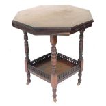 An Edwardian mahogany two tier window table, of octagonal form, raised on turned legs, united by a g
