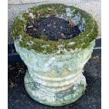 A composition garden planter, of basket form, on a circular base, 37cm high.