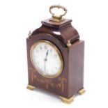 An Edwardian mahogany and inlaid mantel clock, the cream enamel dial bearing Arabic numerals, with b