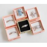 Six silver and paste set dress rings, all boxed.