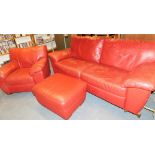 A red leather two seater sofa, 190cm wide, with matching armchair and footstool.