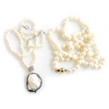 A fresh water and blister pearl pendant necklace, the blister pendant with a surround of pastes, on