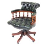 A mahogany and green button leather Captain's chair, with spindle turned supports and X shaped base