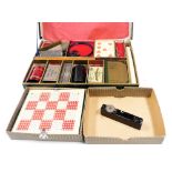 An Ernest Sewell Cabinet of Conjuring Tricks, containing card, coin slide, playing cards, coin box,