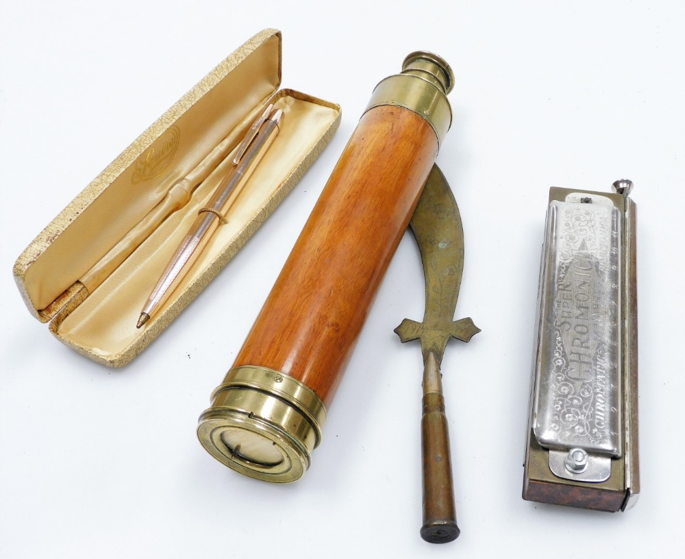 A group of collectables, comprising a Squire ball point pen in gold coloured casing, a brass and tre