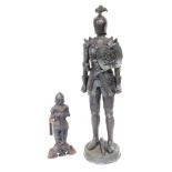 A bronzed plastic figure of a knight, 118cm high, and a fire dog cast as a knight. (2)