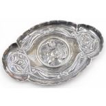 An Edward VII Art Nouveau trinket tray, embossed centrally with a figure of a lady with flowing hair