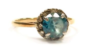 A diamond and gem set dress ring, set with a central blue tourmaline stone, 1.5ct, surrounded by twe