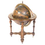 A 20thC terrestrial globe cocktail cabinet, mounted on an oak base with five turned supports, on a X