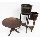 Two similar brass coppered oak jardiniere stands, each of circular form, on tapering supports with u